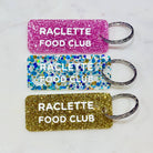 RACLETTE FOOD CLUB Porte-clés à paillettes Plus de Love: Or — Appart 17 Bruxelles