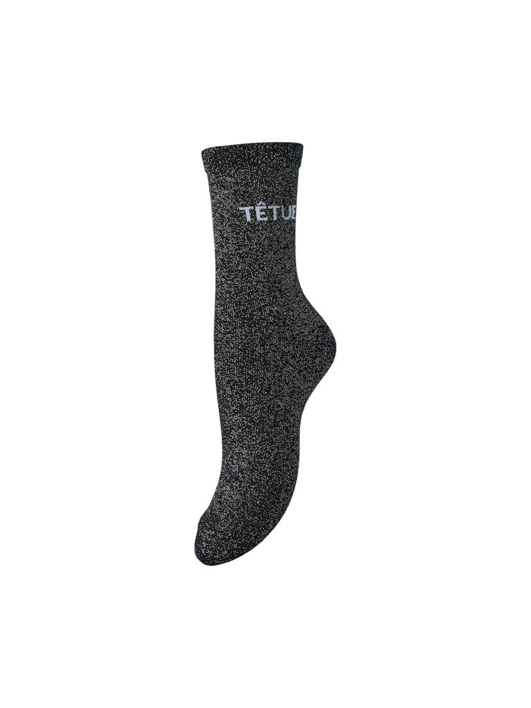 PCSEBBY Chaussettes longues pailletées à slogan — Pieces — Sky Captain TÊTUE — packshot | Appart 17 Bruxelles
