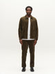 GABjoe Pantalon chino en velours côtelé stretch, coupe tapered — Gabba — Forest Night — porté | Appart 17 Bruxelles