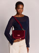 Hindbag Margault Sac bandoulière à rabat, velours ou tartan — Hindbag — Velours bordeaux — porté | Appart 17 Bruxelles