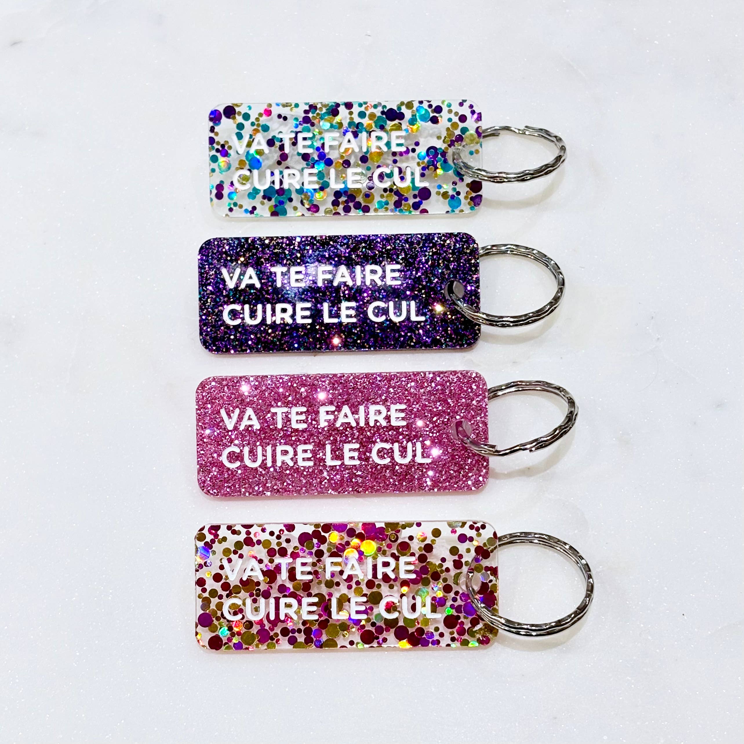 VA TE FAIRE CUIRE LE CUL Porte-clé à paillettes Plus de Love: Violet — Appart 17 Bruxelles