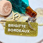 BRIGITTE BORDEAUX Porte-clés à paillettes Plus de Love: Or