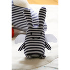 Doudou Ange Lapin avec hochet 20 cm — Trousselier — Marinière — mise en scène sur une couverture blanche 2 | Appart 17 Bruxelles