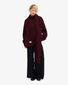 Colorful Standard Merino Wool Scarf Écharpe laine mérinos recyclée — Colorful Standard — Oxblood Red — porté de profil 2 | Appart 17 Bruxelles