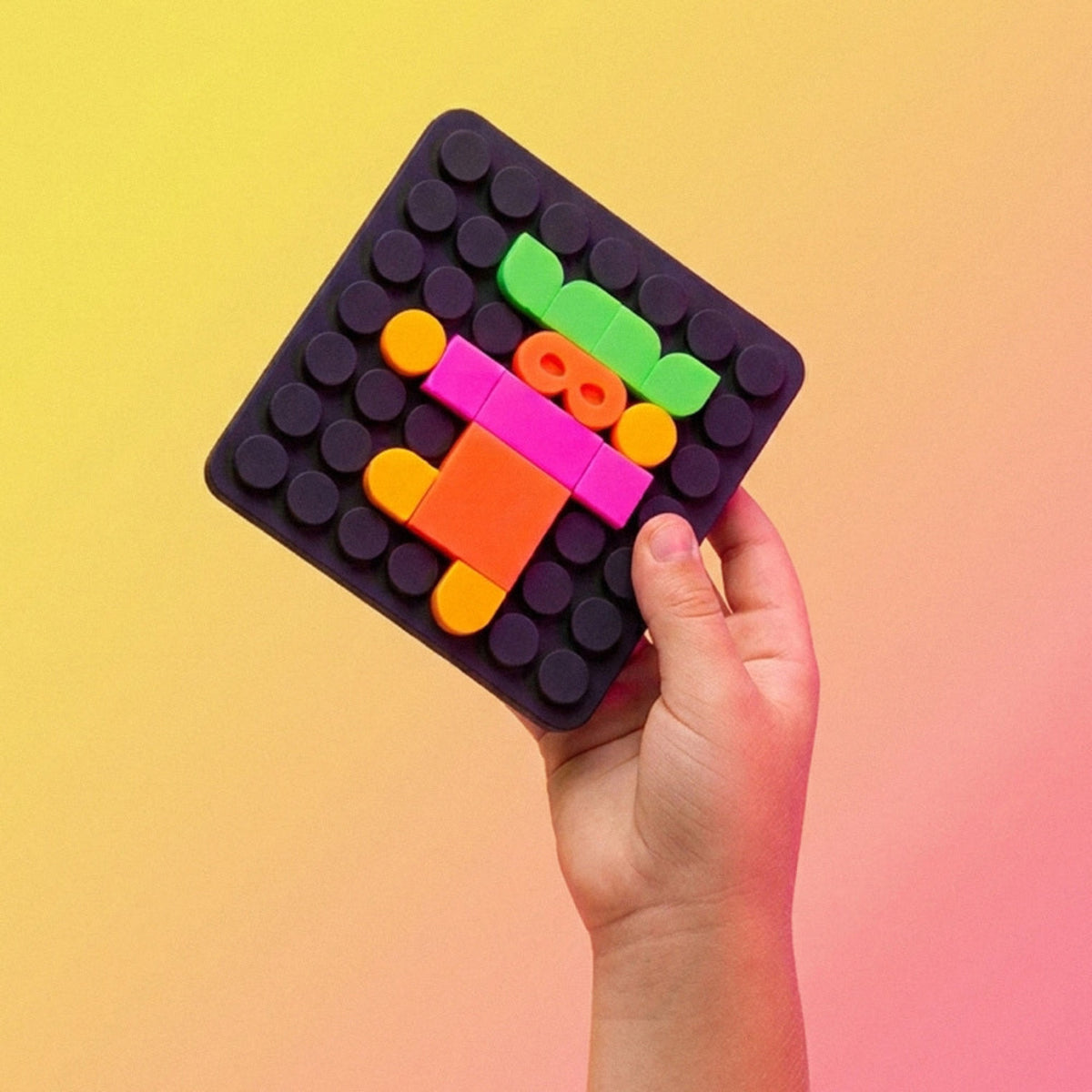 Silipop Pocket, jeu de mosaïque en silicone — SuperPetit — Noir néon — packshot | Appart 17 Bruxelles